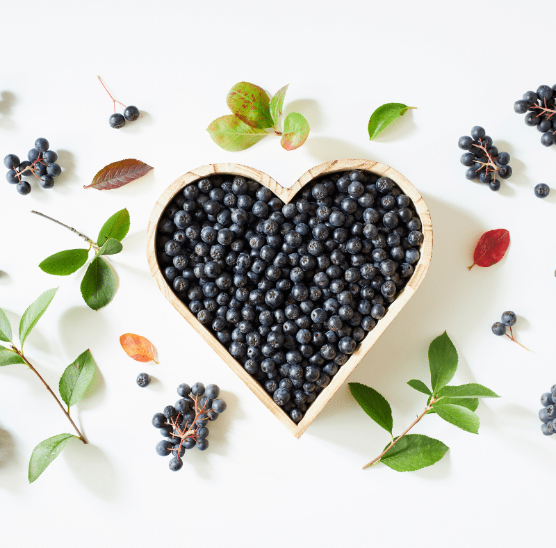 Aronia Berries in a heart shaped bowl.